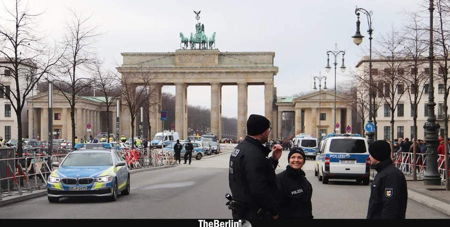Police officers patrol Brandenburg Gate